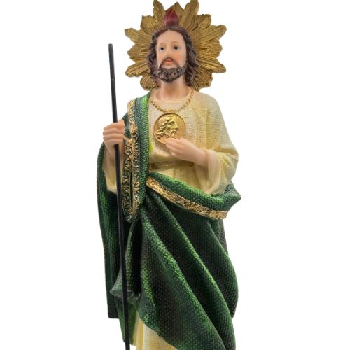 Statue of a Saint Jude  in green and gold robes holding a staff on a white background