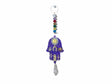 Purple house charm with hand of hamsa for blessing
