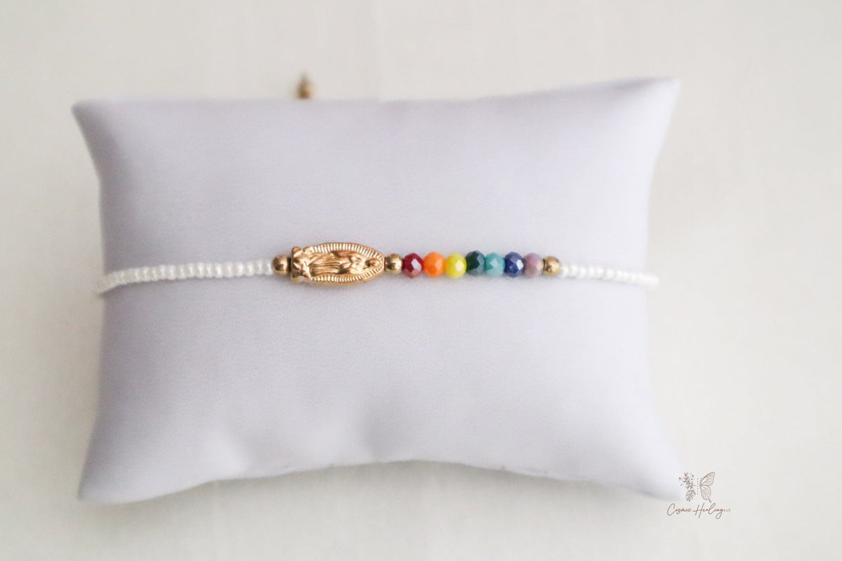 White thread bracelet featuring Seven Chakra stones and Guadalupe