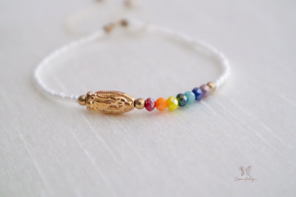 White dainty bracelet showcasing Seven Chakras & Virgen de Guadalupe pendant