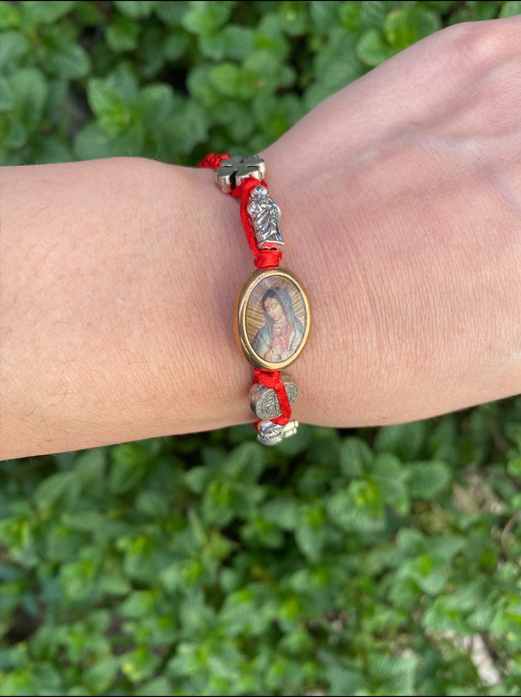 Woven bracelet featuring Virgen De Guadalupe charm