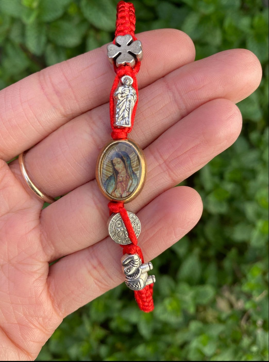 Woven bracelet with Virgen De Guadalupe charm