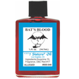 A bottle of 7 Sisters Oil 'Bat's Blood' fragrance oil with a red translucent body and a prominent blue label featuring a bat illustration.
