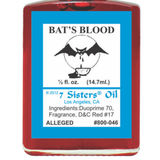 A bottle of 7 Sisters Oil 'Bat's Blood' fragrance oil with a red translucent body and a prominent blue label featuring a bat illustration.