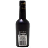 Black bottle with a label on a white background