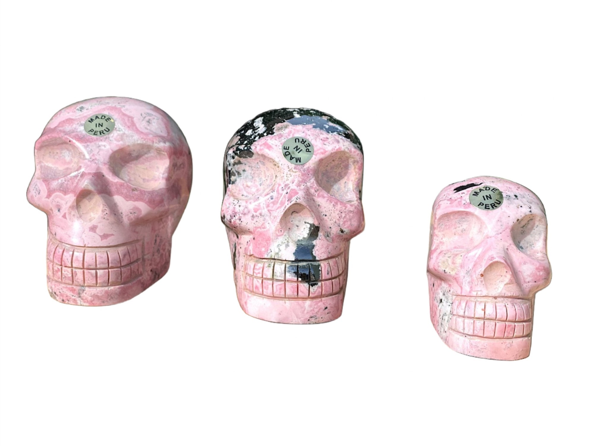 Hand Carved Peruvian Rhodonite Skulls - Shop Cosmic Healing