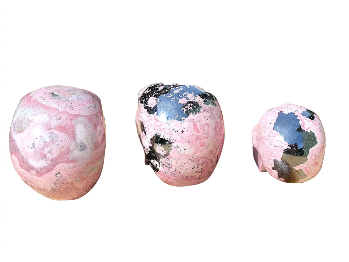 Hand Carved Peruvian Rhodonite Skulls - Shop Cosmic Healing