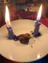 Plate of high john the conqueror whole root with 2 candles