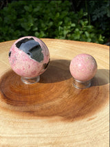 Polished Peruvian Rhodonite crystal ball