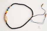 Seven Chakra Guadalupe bracelet crafted from soft black thread