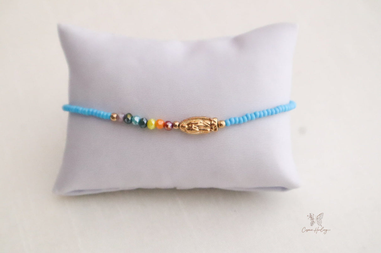 Seven Chakra Guadalupe bracelet crafted from soft blue thread