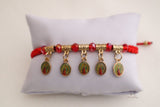 Charm bracelet featuring Virgen de Guadalupe