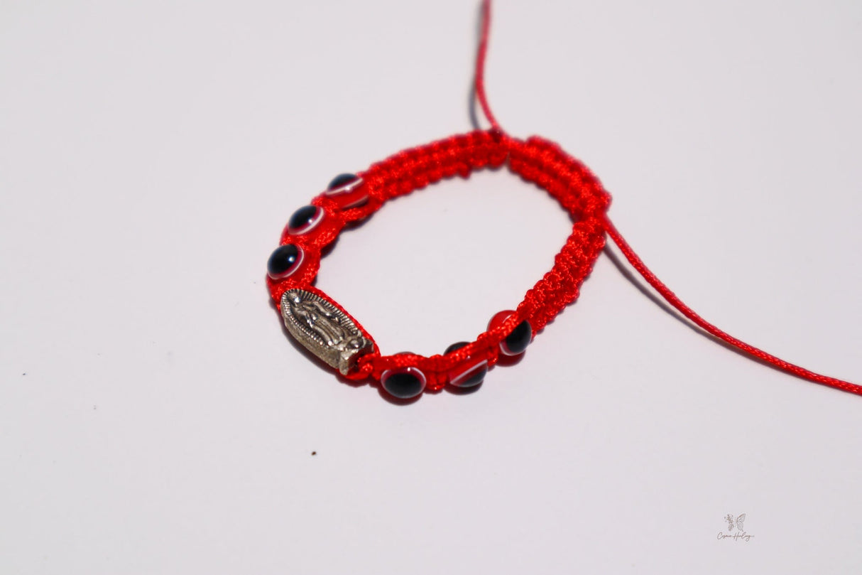 Kid's bracelet with Virgen de Guadalupe medal and red evil eye charm